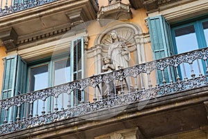 BARCELONA, SPAIN - MAY 16, 2017: View of the sculpture in the one of the historical buildings on the intersection Gran Via de les