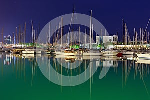 BARCELONA, SPAIN - MAY 16, 2017: View of the sailboats on the pier in center of Barcelona in evening time