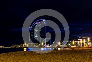 Barcelona, Spain - Nov 15, 2019: View of Barceloneta beach and the iconic sail shaped luxury Hotel Vela or W