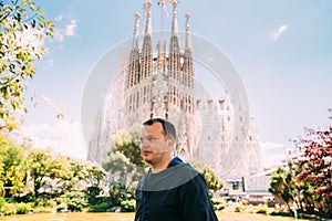 Barcelona, Spain. Portrait Of Caucasus Man On Background Basilica And Expiatory Church Of Holy Family Or Sagrada Familia