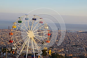 Barcelona, Tibidabo amusement park with ferris wheel photo
