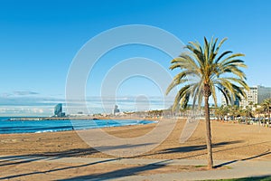 Barceloneta Beach in Barcelona with colorful sky at sunrise. Sea