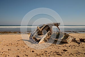 Sunken ship on the shores of Nyang Nyang Beach in Bali, Indonesia. photo