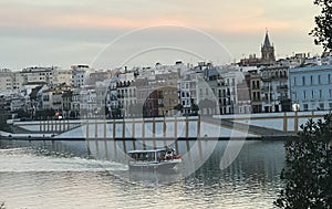 Barco navegando el rÃÂ­o Guadalquivir photo