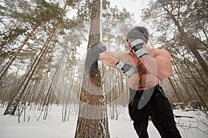 Bare-chested guy kicks old used tire attached to photo