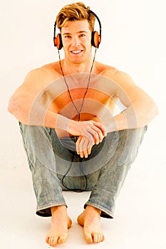 Bare-chested man with headphones