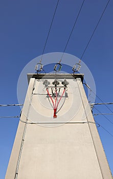 bare copper cables and insulated red electrical wires in the big photo