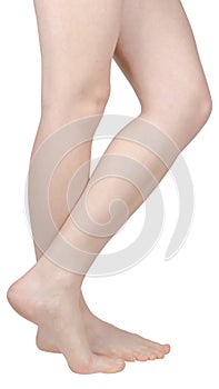 Bare feet of a girl with flat feet, one foot on tiptoe, the inside of the foot is seen, side view isolated on white background