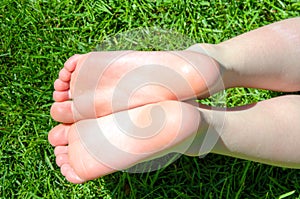 Bare feet in green grass