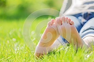 Bare feet on green grass
