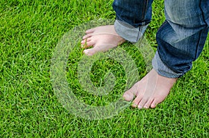 Bare feet on green grass