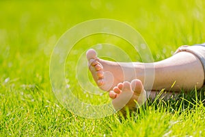 Bare feet on green grass