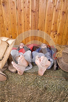 Bare feet on hay serious expressions