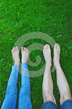 Bare feet and legs in grass