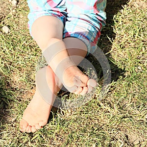 Bare feet of a little girl photo