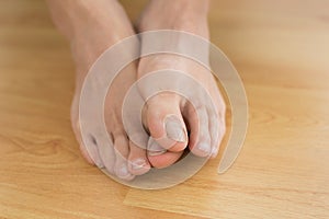 Bare feet on parquet floor