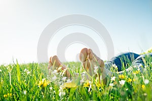 Bare feet on spring grass