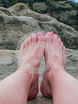 Bare foot with rocky mountain nature background, relax travel concept