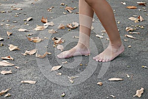 Bare Footed Walking On Tarmac