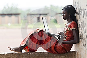 Barefoot African Model Working On Her Laptop Computer Business S