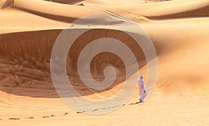 Barefoot Bedouin Walking in Desert of Sharjah