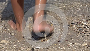 Barefoot Child Playing on Beach, Kid Feet Splashing Sea Water on Seashore, Happy Little Girl on Coastline in Summer Vacation