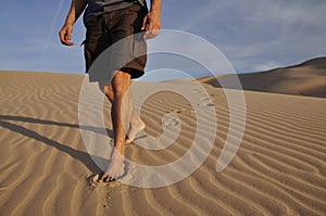 Barefoot desert hiker