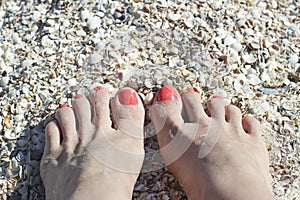 Barefoot feet on sand coast