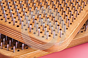 Barefoot female foot stands on a wooden board with nails for concentration practice