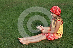 Barefoot girl catching something