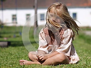 Barefoot girl on grass