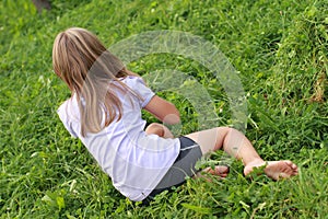 Barefoot girl on grass