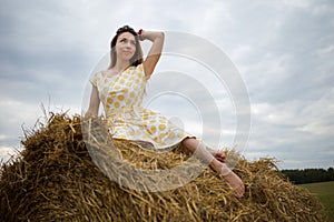 Barefoot girl in the hayloft