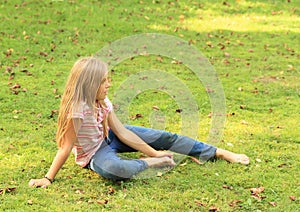 Barefoot girl on meadow