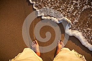 A barefoot man on the beach