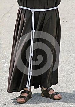 Barefoot with sandals and the habit of a Friar photo