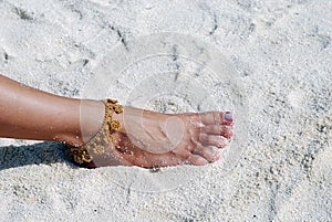 Barefoot on the sandy beach