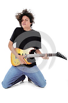 Barefoot Teen Playing Electric Guitar Over White