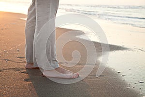 Barefoot woman on the beach