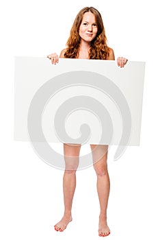 Barefooted naked woman hiding behind a white billboard