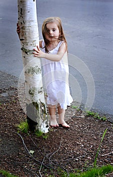 Barefooted Toddler by Tree