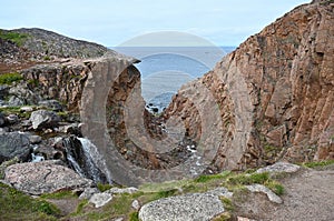 The Barents Sea and Teriberka Waterfall. Arctic, Russia