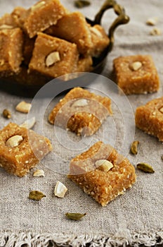 Barfi - indian sweet with coconut flakes, cardamom and cashew
