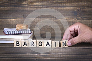 Bargain. wooden letters on the office desk