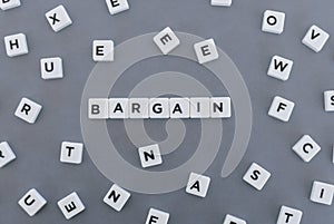 Bargain word made of square letter word on grey background