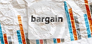 BARGAIN word text on the white memo note crupled sticker on chart background