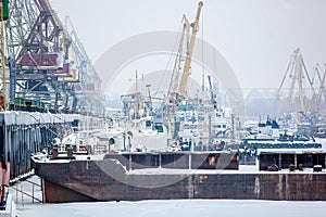 Barge in cargo port at winter