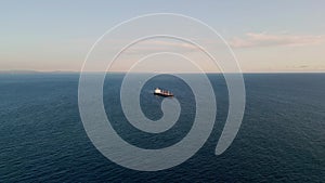 Barge carrier floating ocean surface drone view. Container tanker moving in sea