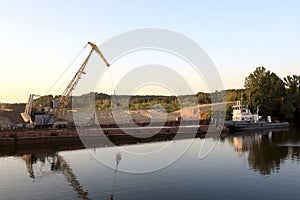 Barge with crane on Oka river