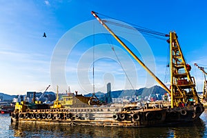 Barge dredging a harbor